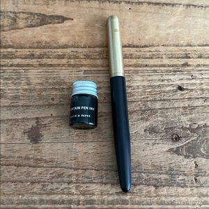 Cloth & paper fountain pen with green ink (used)
